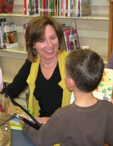 Autographing books gives me a chance to meet my readers one on one.
